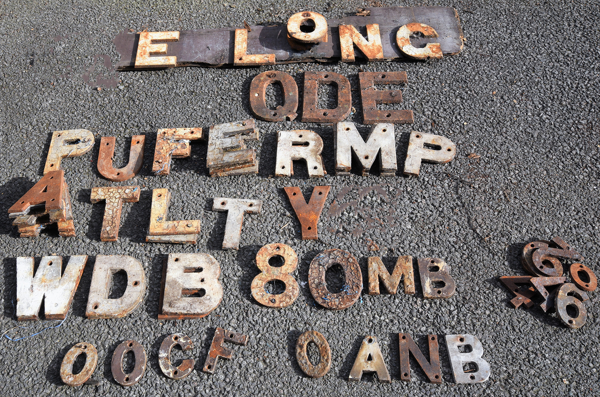 A collection of cast iron notice letters and numbers mostly 7.5 in tall with many duplicate