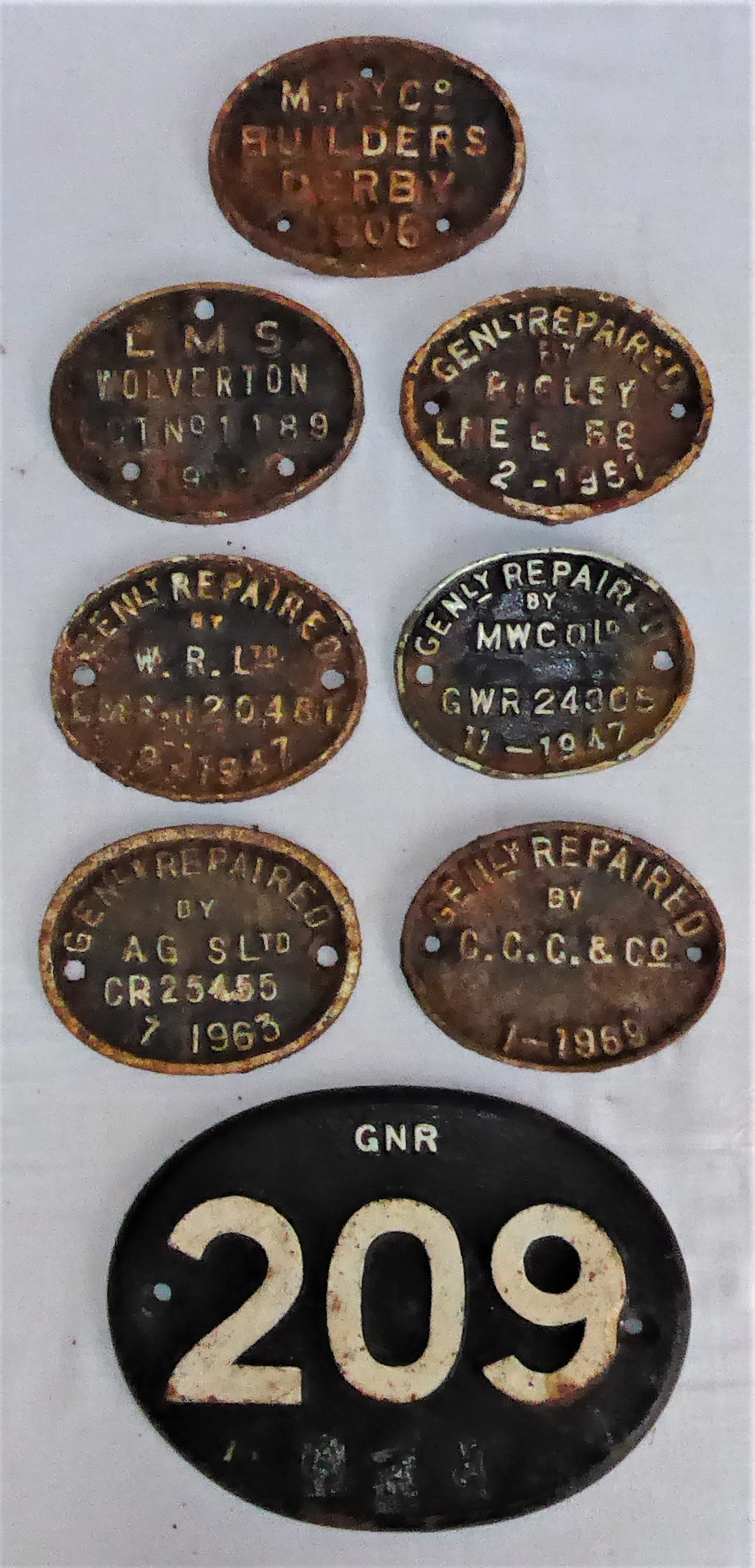 7 x cast iron Gen Repaired oval plates from various locations together with a GNR 209 cast number