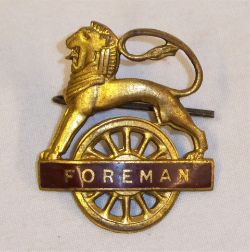 BR(W) Lion over Wheel FOREMAN Cap Badge complete with rear securing pin. Excellent original