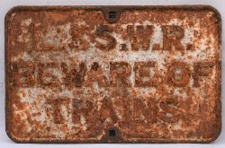 L&SWR Cast iron sign. BEWARE OF TRAINS. Original condition devoid of paint. Measures 26in x 16.25