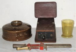 A Lot containing various railway items to include an LMS land mine ink well. LMS leather address