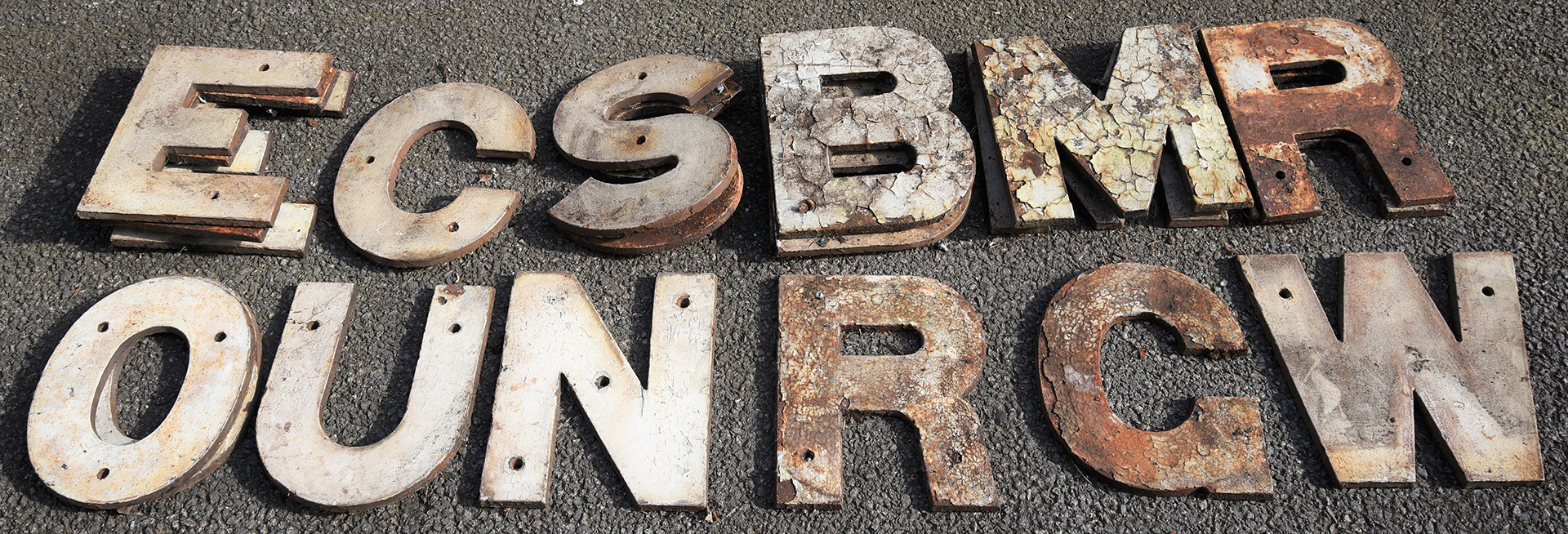 A collection of 19 x 12 inch cast iron running in board letters all complete as per illustrated