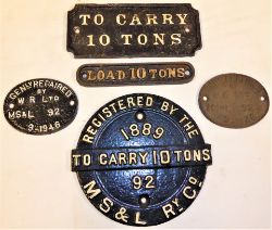 A collection of cast iron Wagon Plates which appear to be recovered from the same vehicle. TO