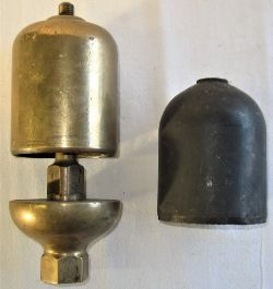 Unmarked locomotive steam whistle minus top nut together with a spare bell top.