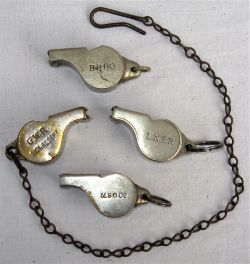 A lot containing 4 x Acme Thunderer Guards Whistles. Stamped on side G.W.R Signal Dept complete with