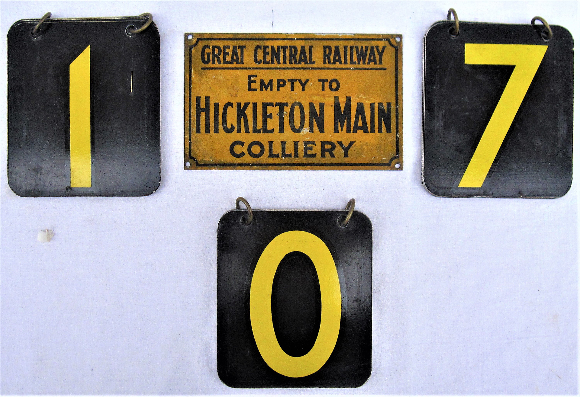 3 sets of ringed LT numbers 0 - 7 together with a tin plate Great Central Railway wagon label