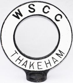 Road sign WSCC THAKEHAM. From the top of a road finger post sign. The village is in West Sussex 12