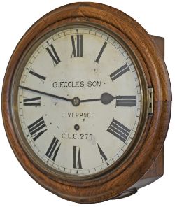 Cheshire Lines Committee 12in dial oak cased railway clock with a spun brass bezel and a going