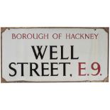 Road sign BOROUGH OF HACKNEY WELL STREET E9. Enamel with original bronze frame, measures 32.5in x