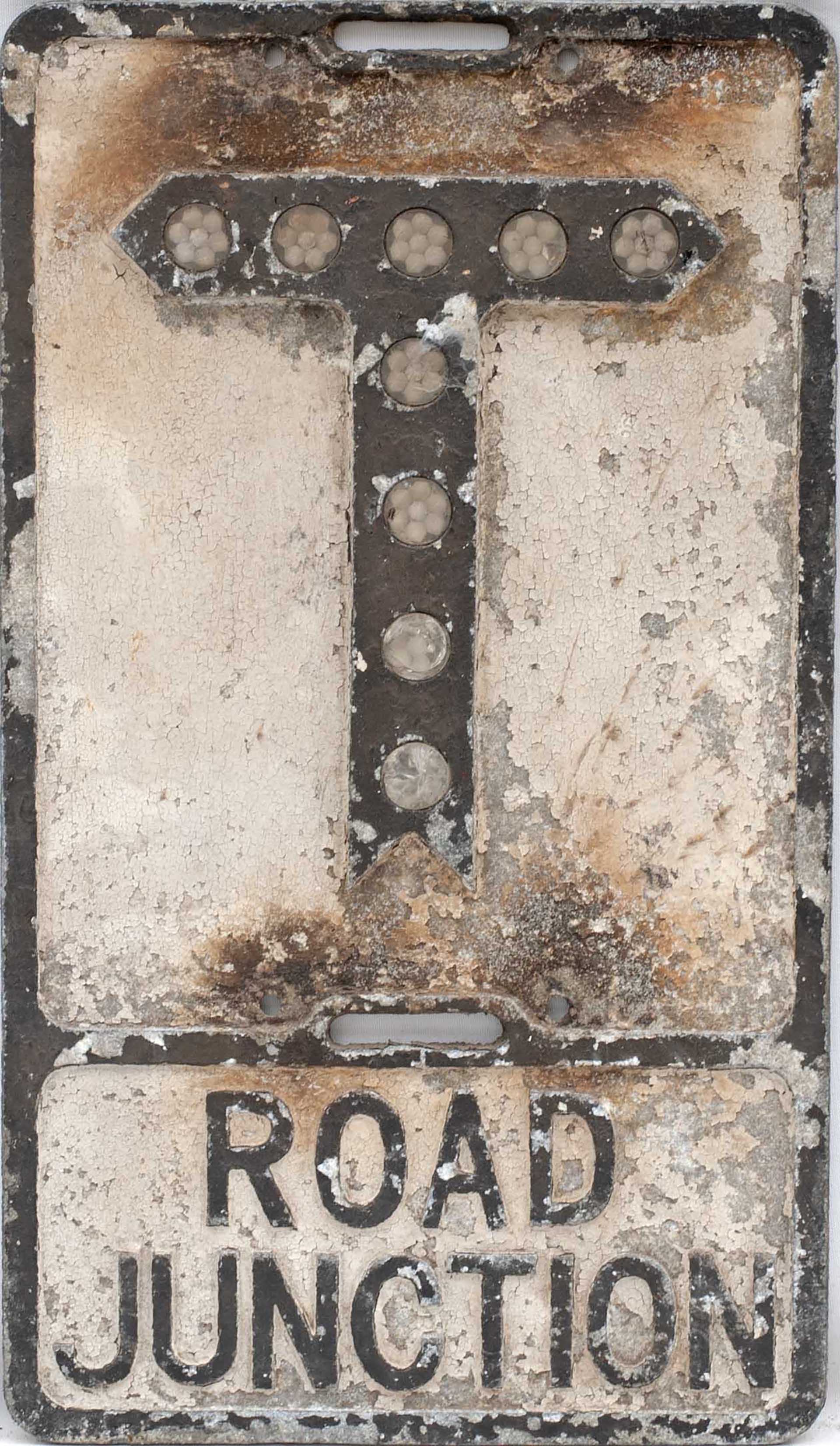 Road sign ROAD JUNCTION T measuring 21.25in x 12.25in. Cast aluminium in as removed condition
