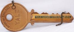 Advertising display sign in the shape of a large yale key with YALE KEYS STOCKED HERE . Cast