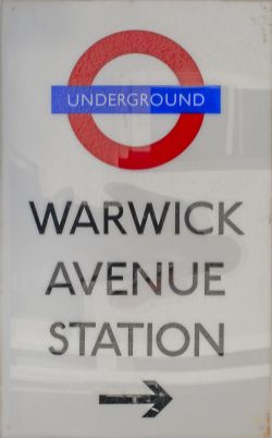 London Underground station direction sign WARWICK AVENUE STATION with right pointing arrow. Two