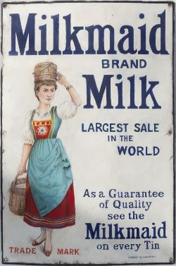 Advertising enamel sign MILKMAID BRAND MILK LARGEST SALE IN THE WORLD. In good displayable condition