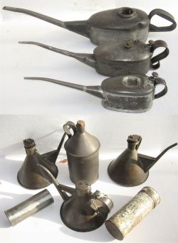 A lot containing a collection of Oil cans & Measures to include an LNWR Detonator canister. LMS lamp