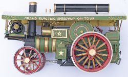 A painted model of a Showman's Traction Engine. Slight damage to top of glass case.