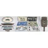 A lot containing a collection of motoring items to include 6 x American car number plates. Old