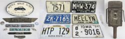 A lot containing a collection of motoring items to include 6 x American car number plates. Old