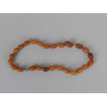 A graduated amber bead necklace