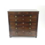 A Victorian mahogany and boxwood strung secretaire chest, having a concealed frieze drawer above a