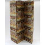 A large Edwardian four-fold screen, covered in folk art style fabric, 183cm high, 204cm wide (each