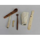A group of prisoner of war treen and bone carvings, including a book mark from Bermuda dated 1802, a