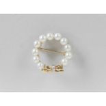 A cultured pearl and diamond set wreath brooch