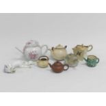 A group of Chinese and Japanese teapots and a Hirado dragon (some damages).