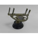 A 19th-century brass graphometer, semi-circular frame with 180-degree scale and adjustable sights,