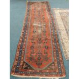 An Anatolian runner, 280cm x 83cm, together with a Central Persian rug, 190cm x 128cm (heavily