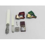 A group of gentleman's accessories including two silver-mounted ivory page turners, two cased