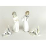 Nao figures of boy and girl at bedtime and two models of geese, printed factory marks (4)