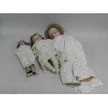 Two German porcelain headed dolls, the first Heubach, numbered 250.11, 73cm (hairline to back of