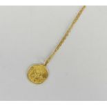 A yellow metal St Christopher’s pendant on chain