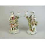 A pair of Derby porcelain candlesticks, circa 1760