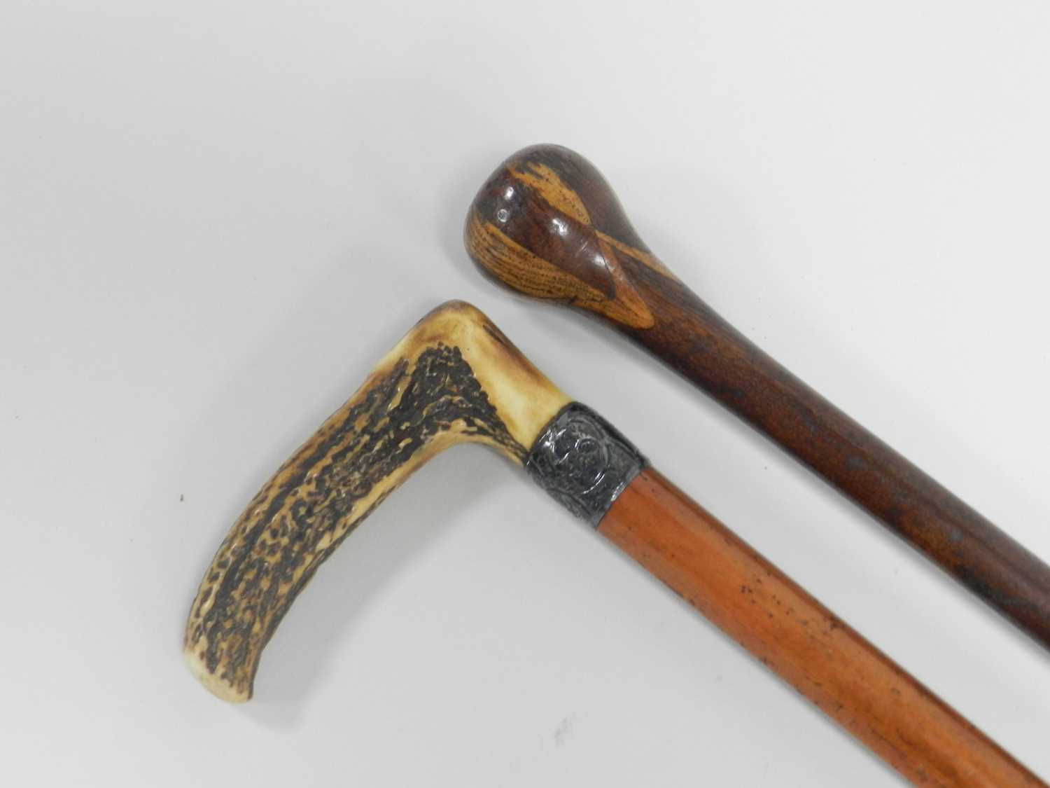 A horn-handled cane, with silver collar on a tapering birch cane, 89cm long, together with an inlaid - Image 2 of 2