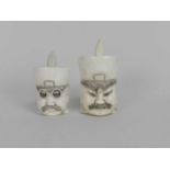 A pair of Japanese carved ivory snuff pots, circa 1900, modelled as the busts of officials, 5.5cm