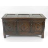 A late 18th century oak geometric moulded coffer, the moulded three-panel top opening to a plain