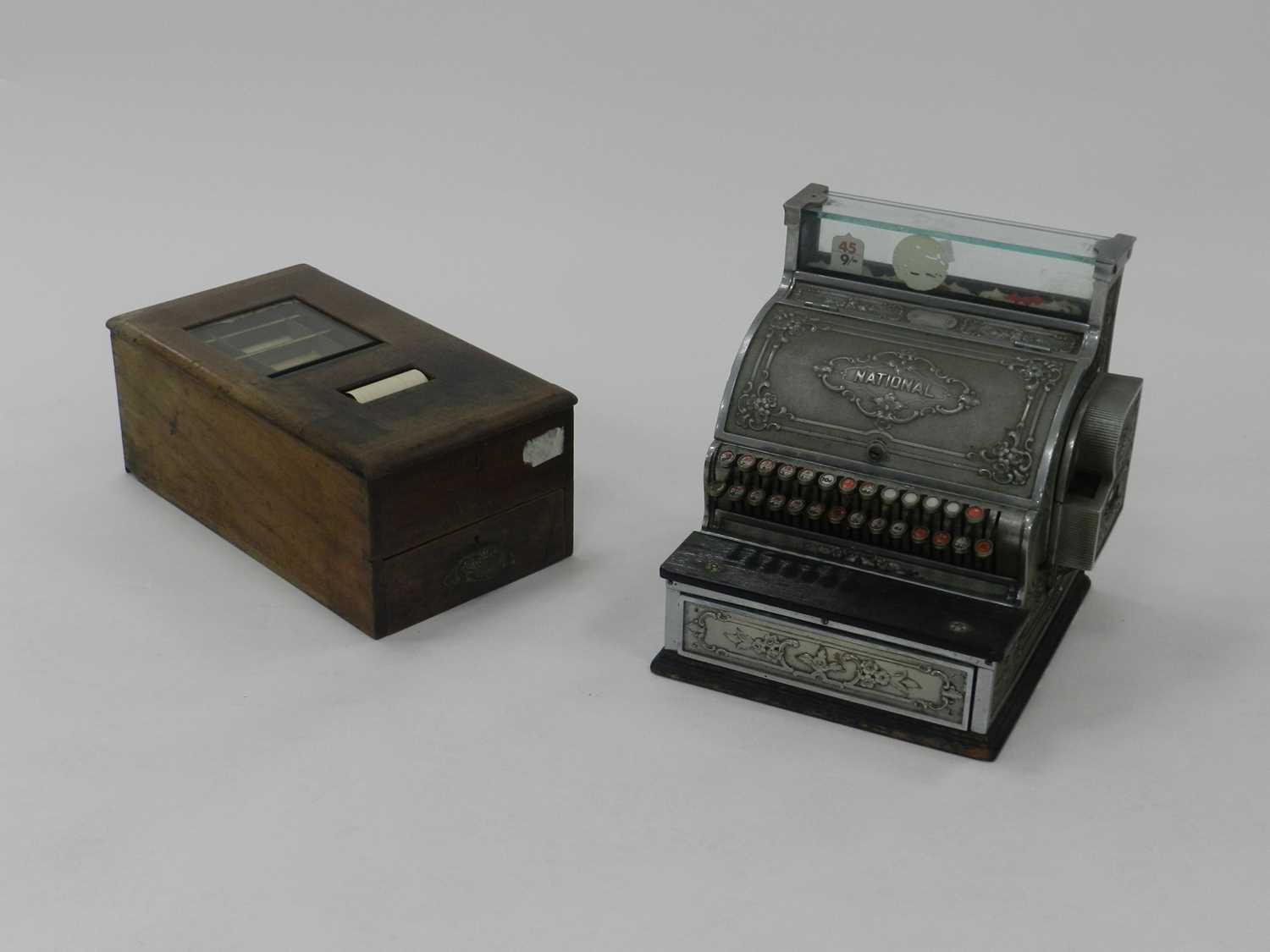 A National Cash Register embossed metal counter-top till, together with an Edwardian wood-cased