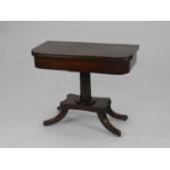 A late Victorian mahogany fold over pedestal tea table, of D form, the revolving top on a plain stem