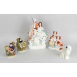 A group of Staffordshire earthenware figures19th century and latercomprising a flatback group of