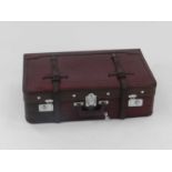 A recent vintage leather suitcase, in dark red with chromium fittings, the interior lined with