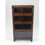 An Edwardian four-tier glazed bookcase, 72cm wide, 135cm high, 30cm deep.Condition report: Small
