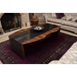 A contemporary modernist bespoke figured walnut veneered and painted composite coffee table, by