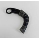 An Indonesian Karambit Claw knifeearly 20th century, with hole finger grip, leading to a curved body