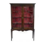 A 19th century mahogany, astragal glazed cabinet, on a later stand