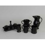 A good collection of black-glazed Jackfield pottery, comprising a jug, circa 1780; a twin-handled