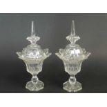 A pair of Victorian lead crystal sweetmeat dishes and covers