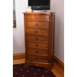 A reproduction walnut tallboy type chest of drawers, the moulded top above a slightly bow-fronted