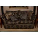 A recent reproduction Knoll sofa, with pinecone carved finials and covered in a damask style fabric,