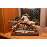 Guiseppe Armani for Florence Arts, 'Born Free', a cast resin sculpture of three horses leaping